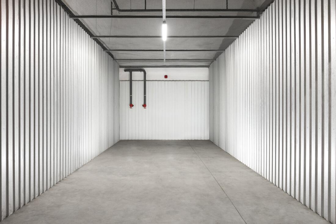 An empty storage unit representing how a property manager can benefit from a storage solution